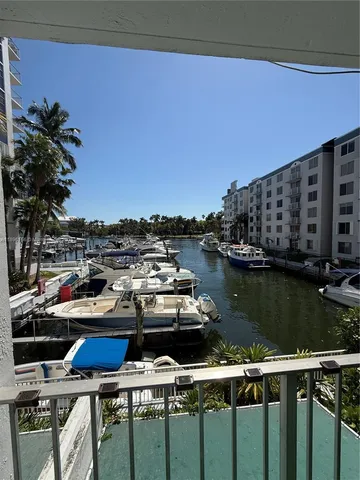a view of a balcony with chairs and a table
