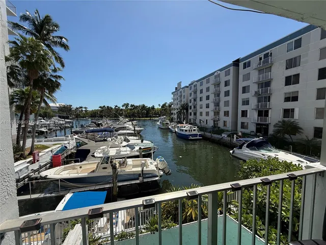 a view of roof deck with two chairs and wooden floor