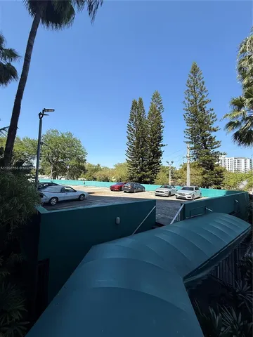 a view of house with outdoor space and sitting area