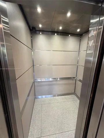 a view of walk in closet with an empty space