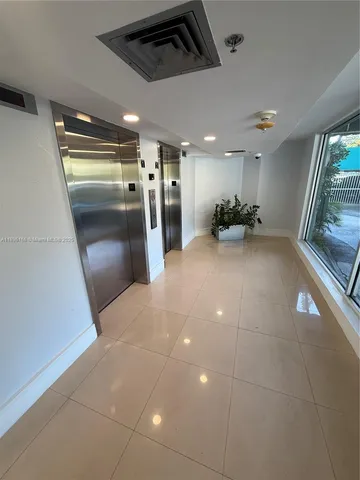 a view of a refrigerator in a room