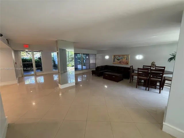 a living room with furniture and a swimming pool