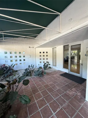 a room with lots of people and a chandelier