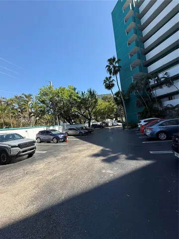 a view of street with parked cars