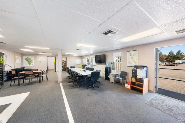a view of a garage with rack and bicycle