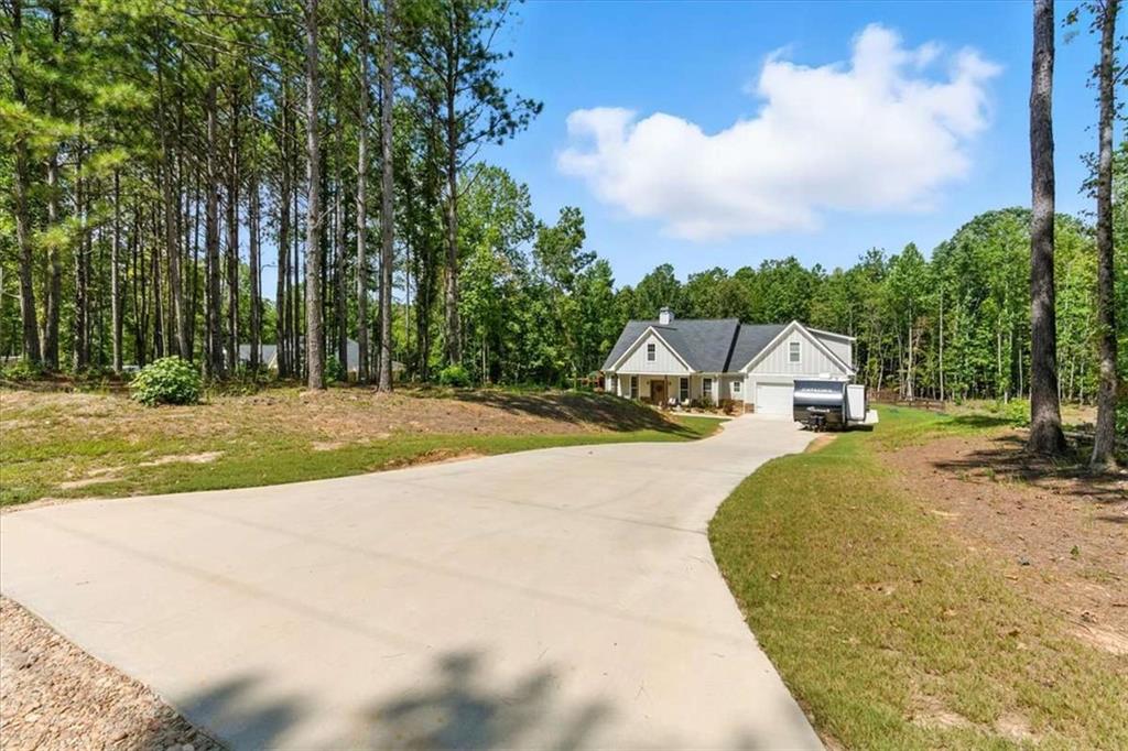 62 Joe Rowell Road Buchanan, GA 30113 - Photo 3 of 63 a view of a street with houses
