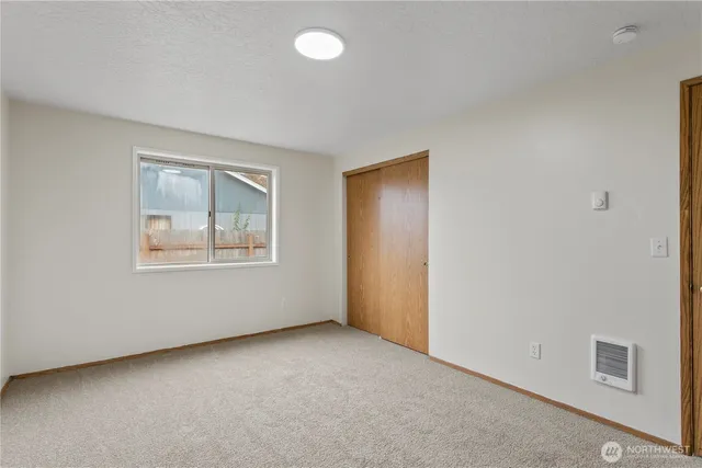 a bathroom with a sink shower and a mirror