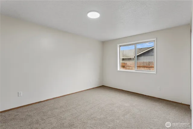 a bathroom with a bath tub with a shower