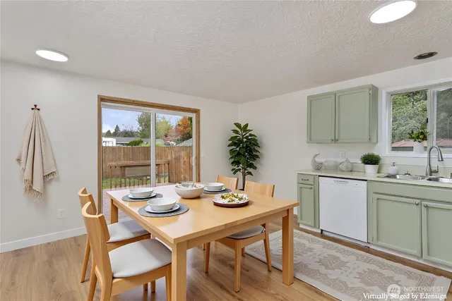 a kitchen with a table and chairs in it