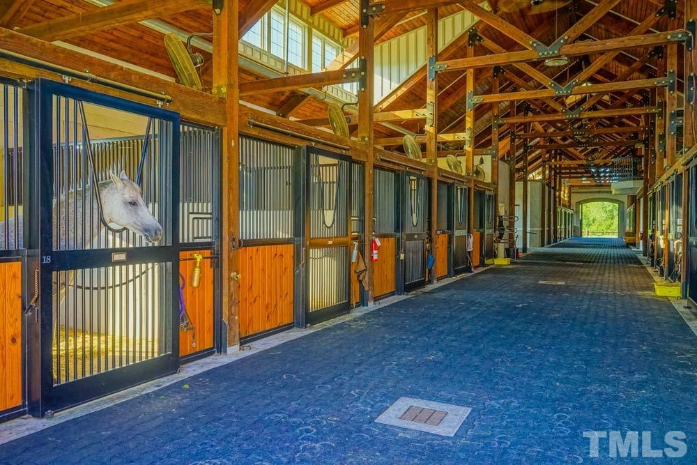 516 Gianna Drive, Unit 449 Clayton, NC 27527 - Photo 13 of 21 a view of a porch with wooden floor and fence