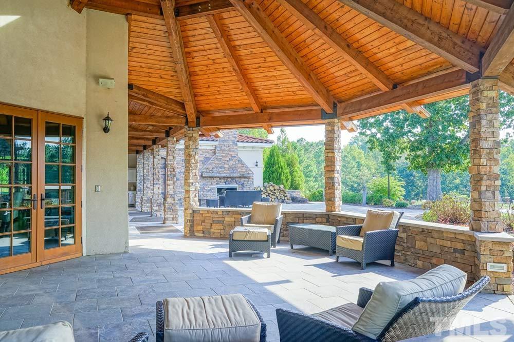 516 Gianna Drive, Unit 449 Clayton, NC 27527 - Photo 17 of 21 a outdoor living space with patio furniture and garden view