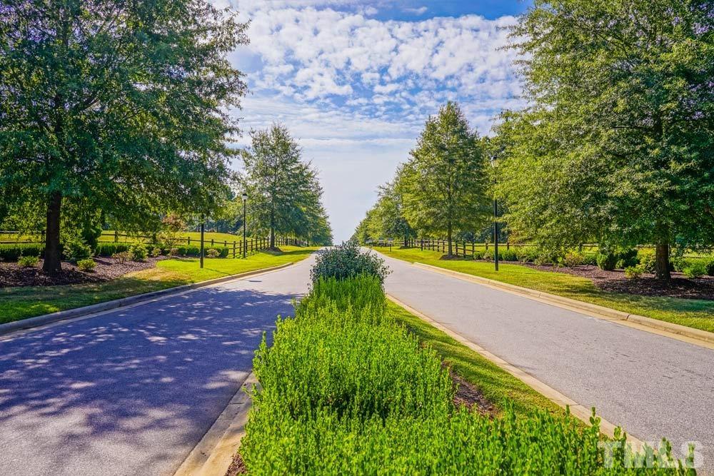 516 Gianna Drive, Unit 449 Clayton, NC 27527 - Photo 9 of 21 a view of a swimming pool with an outdoor space and seating area