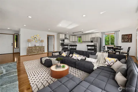 a living room with furniture a rug and a fireplace