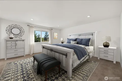 a bedroom with a bed and cabinets