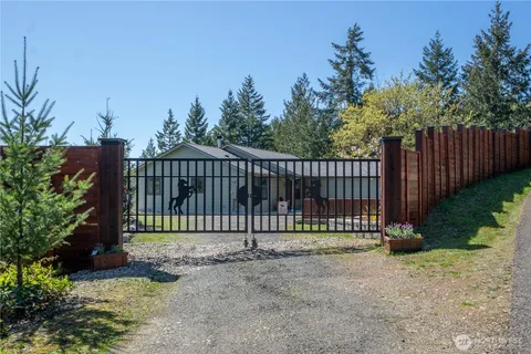 a view of a fence with a small yard