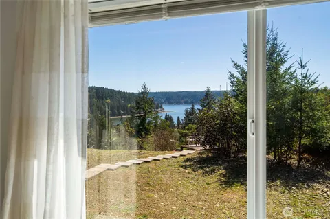 a view of a glass door and a yard