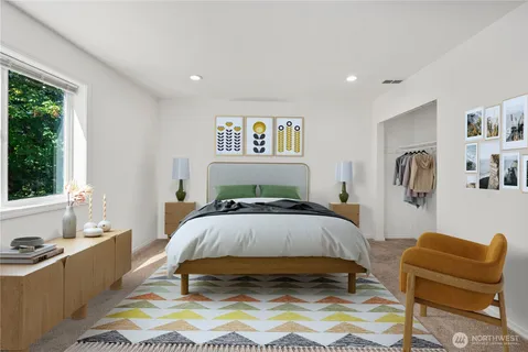 a spacious bedroom with a bed and a couch
