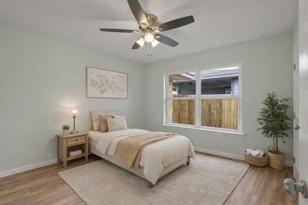 732 Bullock Street Denison, TX 75020 - Photo 10 of 29 a bedroom with a large bed and a window