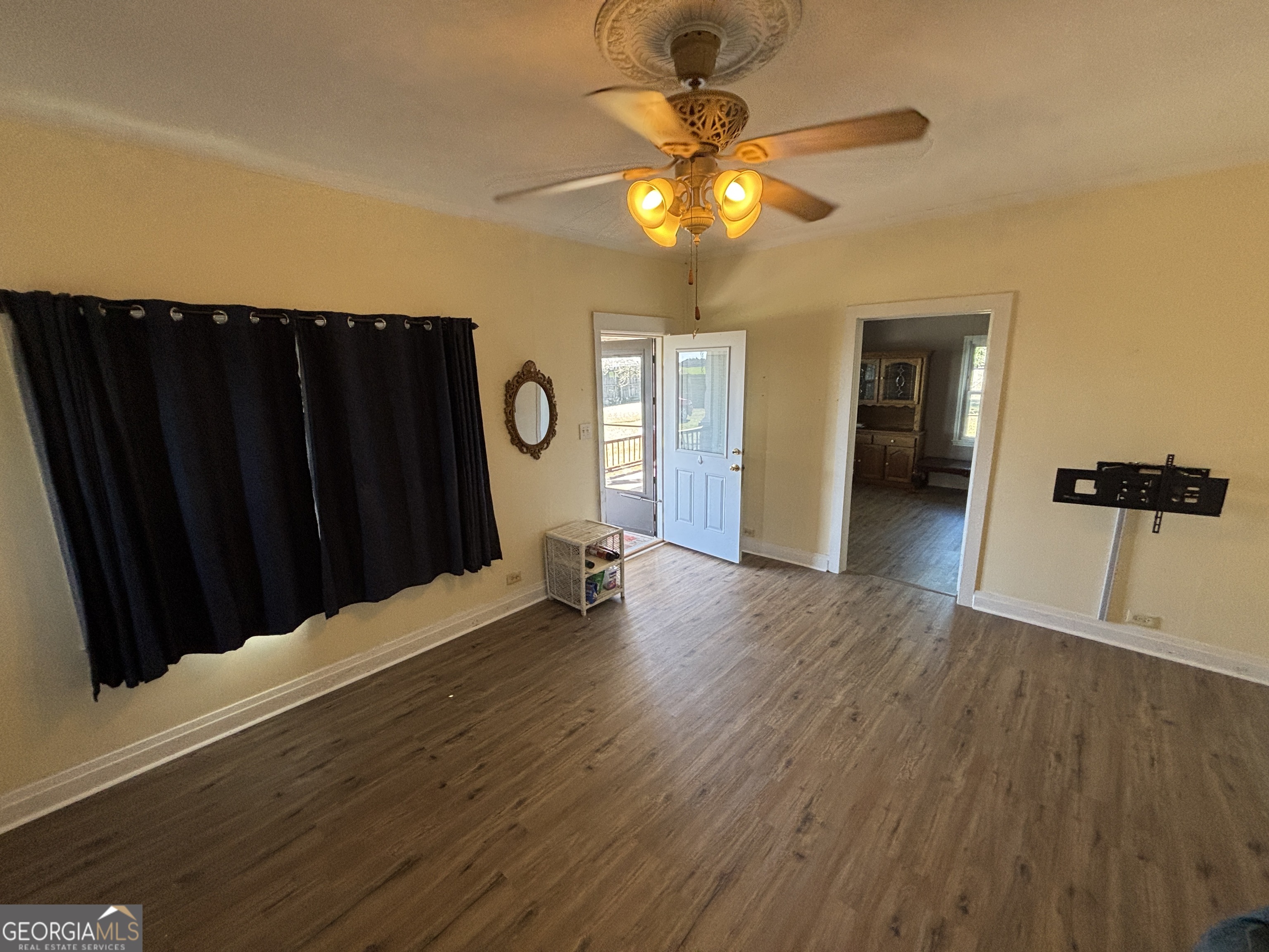 231 Barlow Road Cochran, GA 31014 - Photo 10 of 65 wooden floor in an empty room with a window