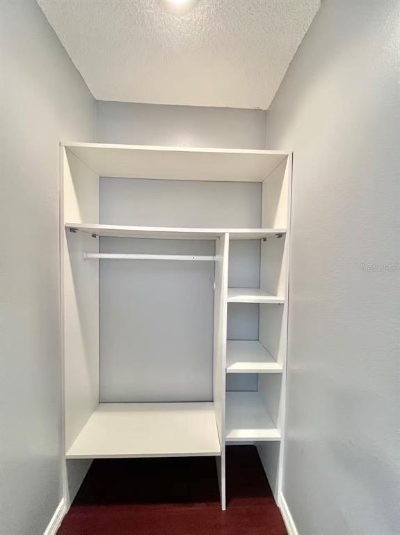 8341 Duval Drive Port Richey, FL 34668 - Photo 18 of 27 a view of walk in closet with empty racks