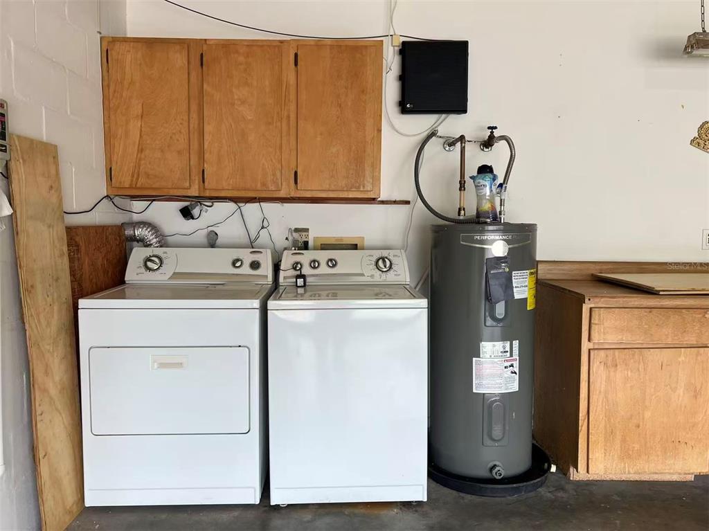 8341 Duval Drive Port Richey, FL 34668 - Photo 25 of 27 a utility room with dryer and washer
