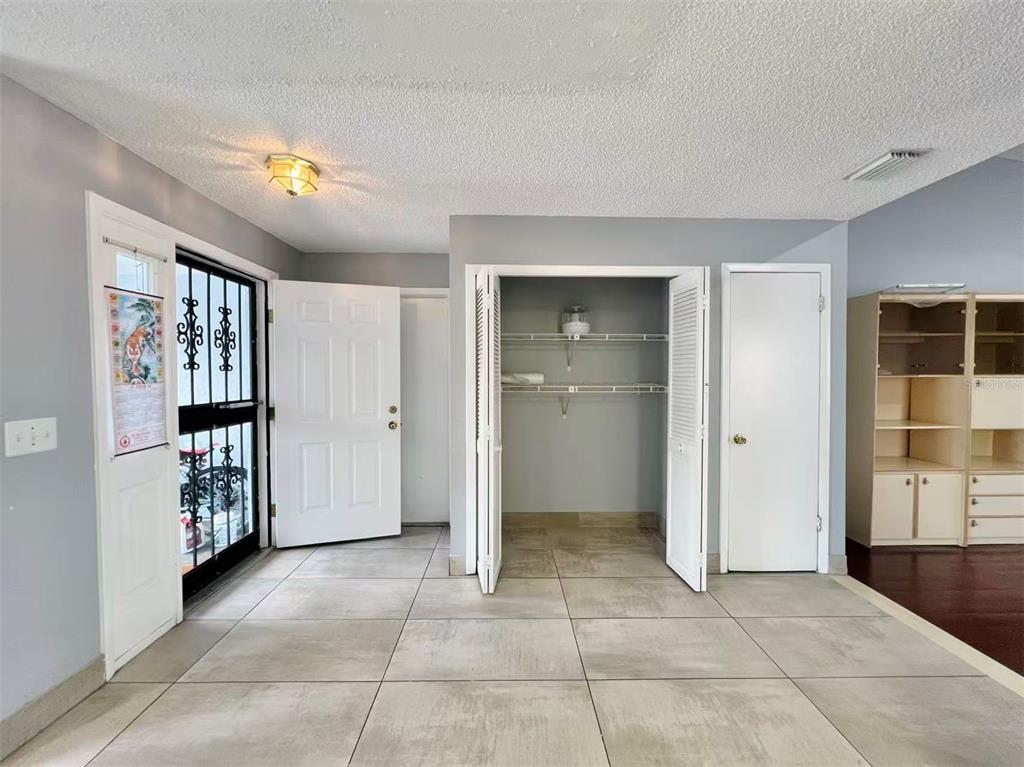 8341 Duval Drive Port Richey, FL 34668 - Photo 7 of 27 a view of a big room with closet and windows