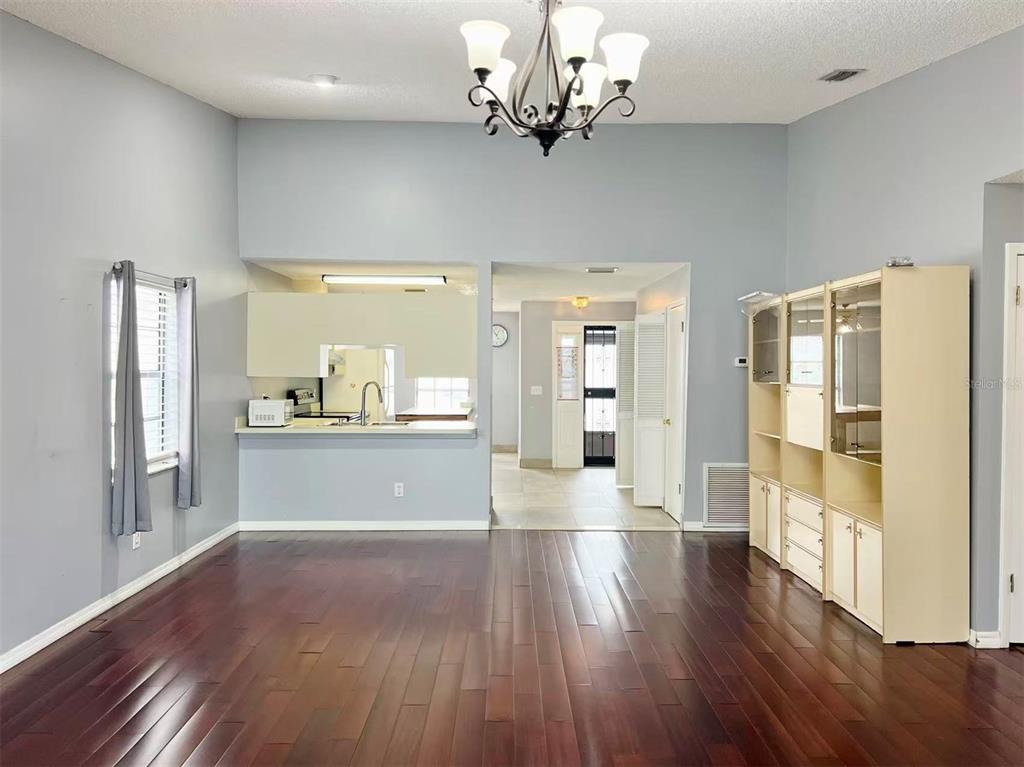 8341 Duval Drive Port Richey, FL 34668 - Photo 9 of 27 a view of a entrance and room with wooden floor