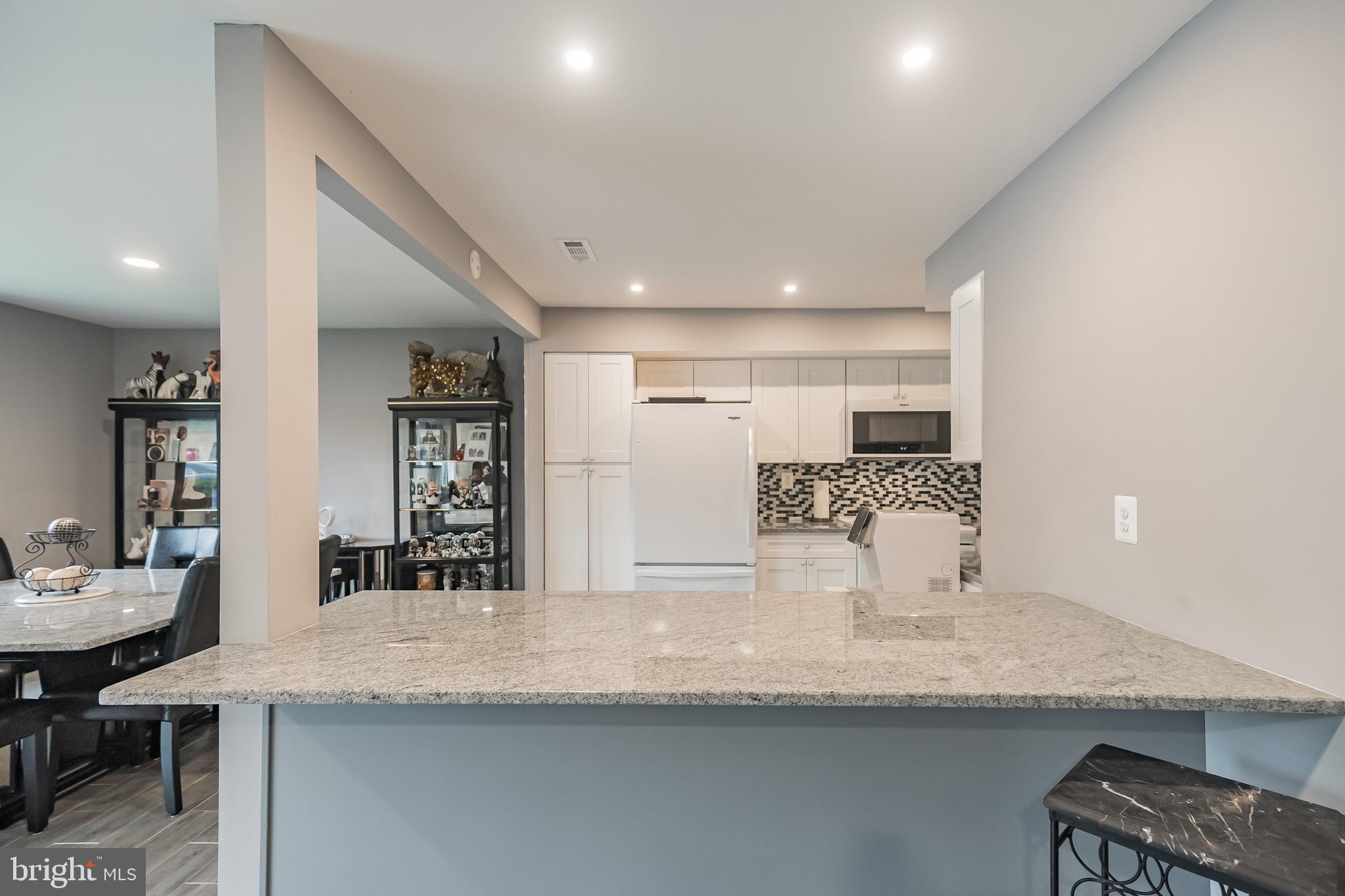 115 East Kings Highway, Unit 221 Maple Shade, NJ 08052 - Photo 12 of 19 Enlarged custom granite countertop peninsula