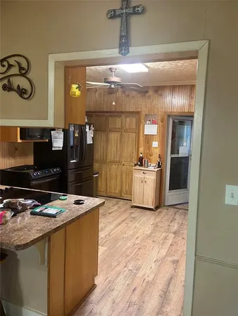 a kitchen with kitchen island a counter top space a sink and appliances