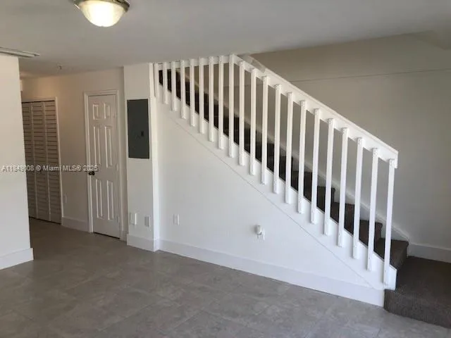 a view of a hallway with staircase
