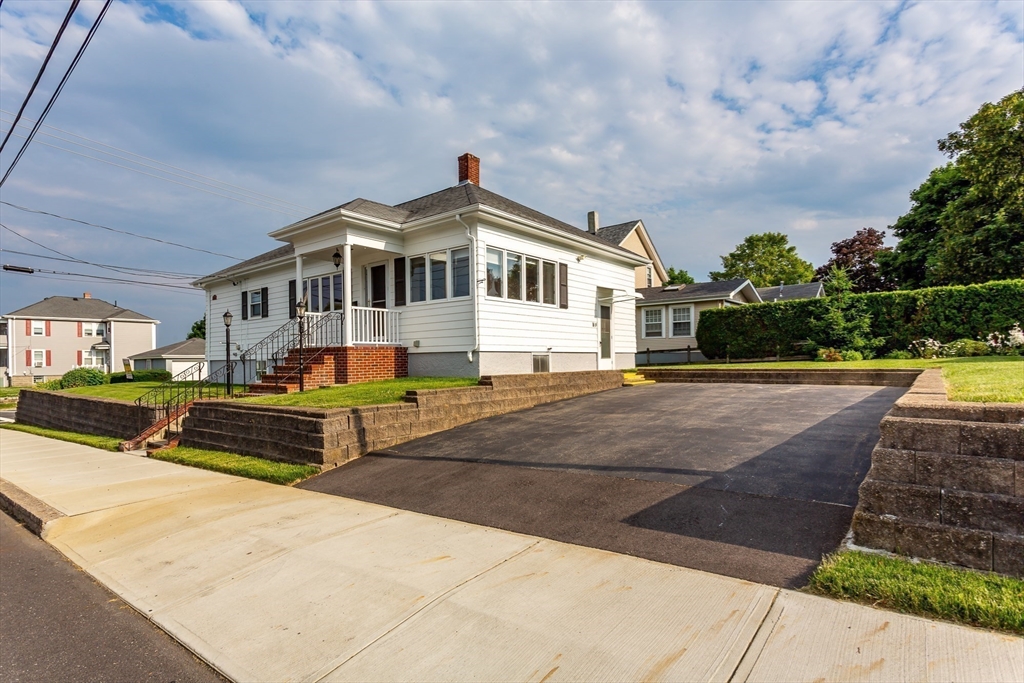 1895 Rodman Street Fall River, MA 02721 - Photo 2 of 26 a front view of a house with swimming pool