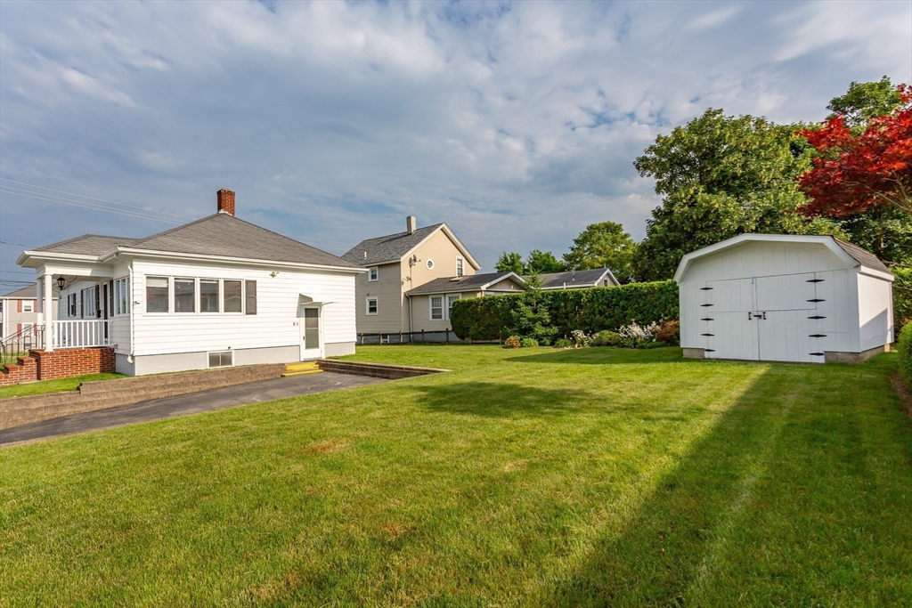 1895 Rodman Street Fall River, MA 02721 - Photo 4 of 26 a front view of a house with a yard