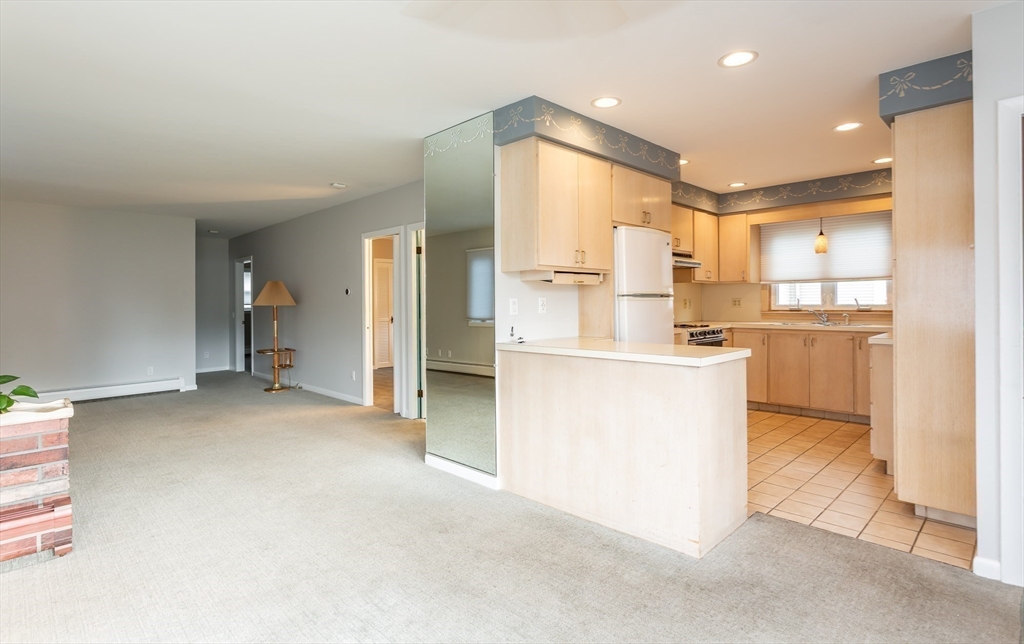 1895 Rodman Street Fall River, MA 02721 - Photo 9 of 26 a kitchen with refrigerator and cabinets