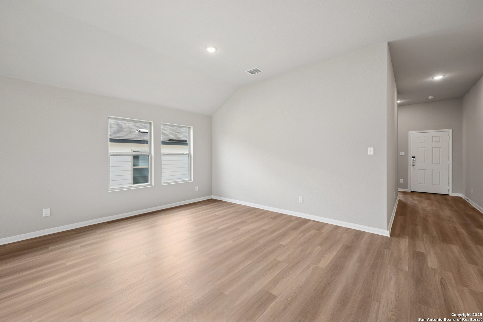 2825 Sun Bayou Seguin, TX 78155 - Photo 11 of 40 a view of an empty room with wooden floor and a window