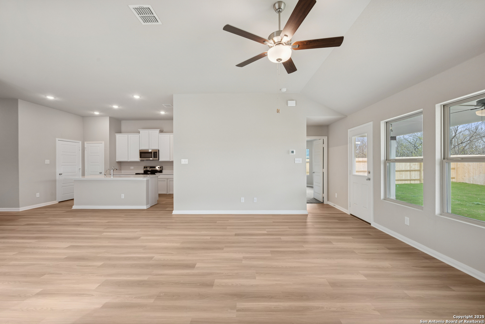 2825 Sun Bayou Seguin, TX 78155 - Photo 12 of 40 a view of an empty room with wooden floor and a ceiling fan