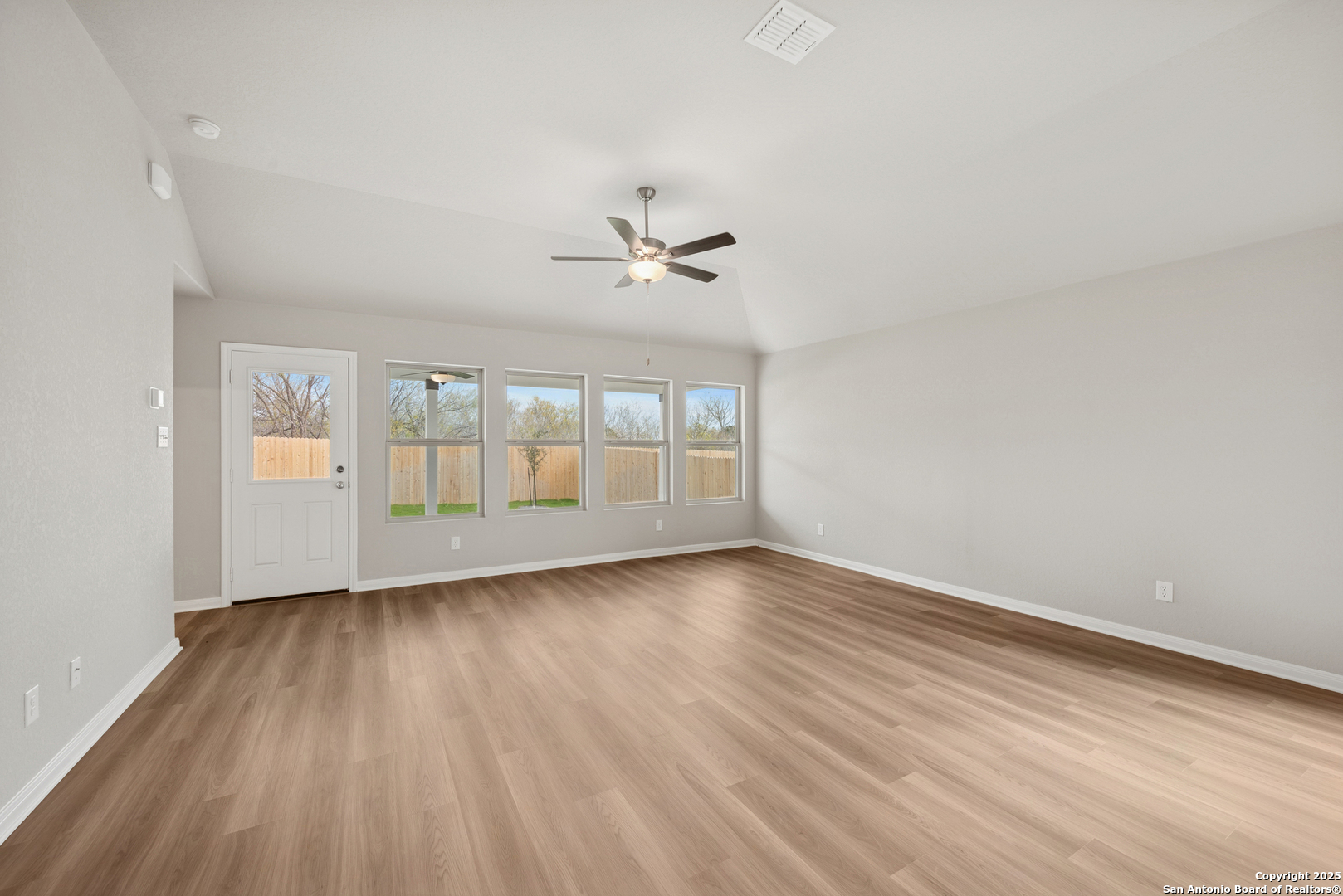 2825 Sun Bayou Seguin, TX 78155 - Photo 13 of 40 wooden floor in an empty room with a window