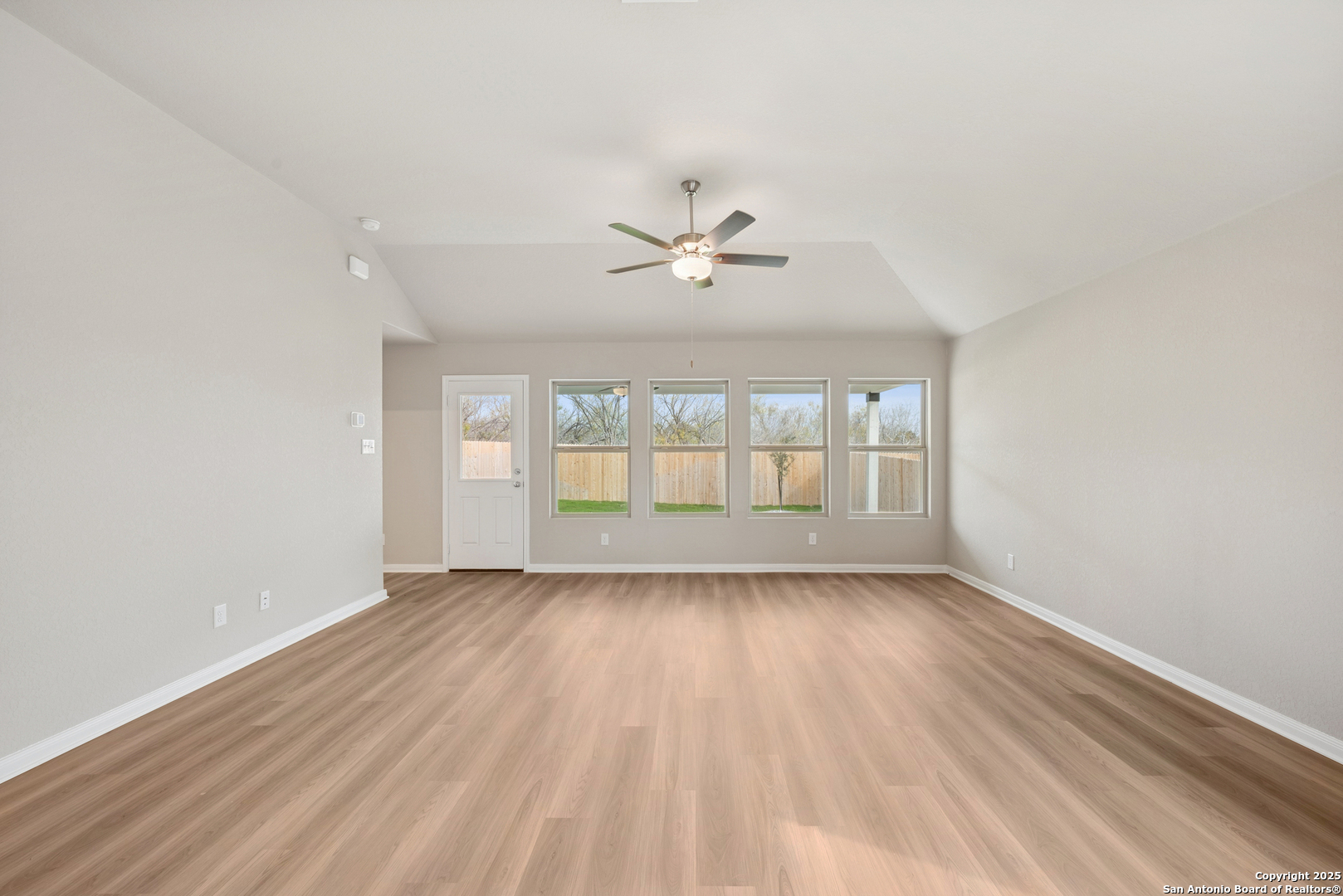 2825 Sun Bayou Seguin, TX 78155 - Photo 14 of 40 wooden floor in an empty room with a window