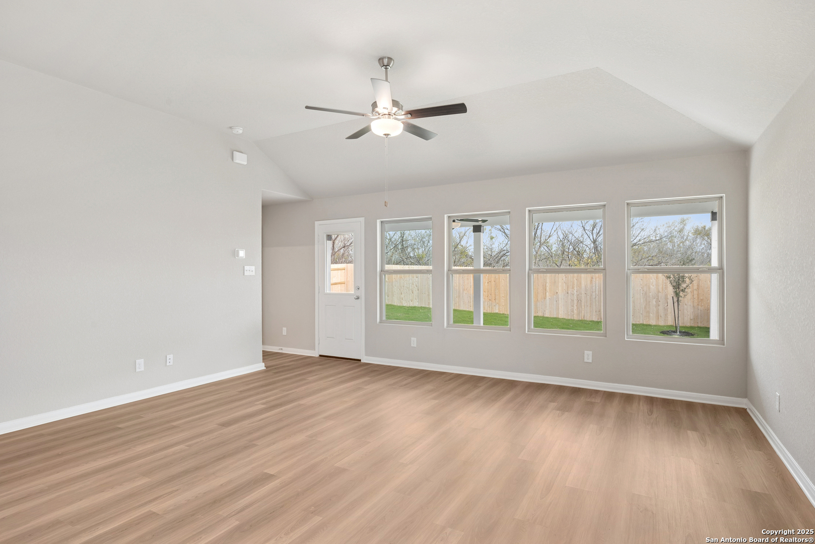 2825 Sun Bayou Seguin, TX 78155 - Photo 15 of 40 a view of an empty room with wooden floor and a window