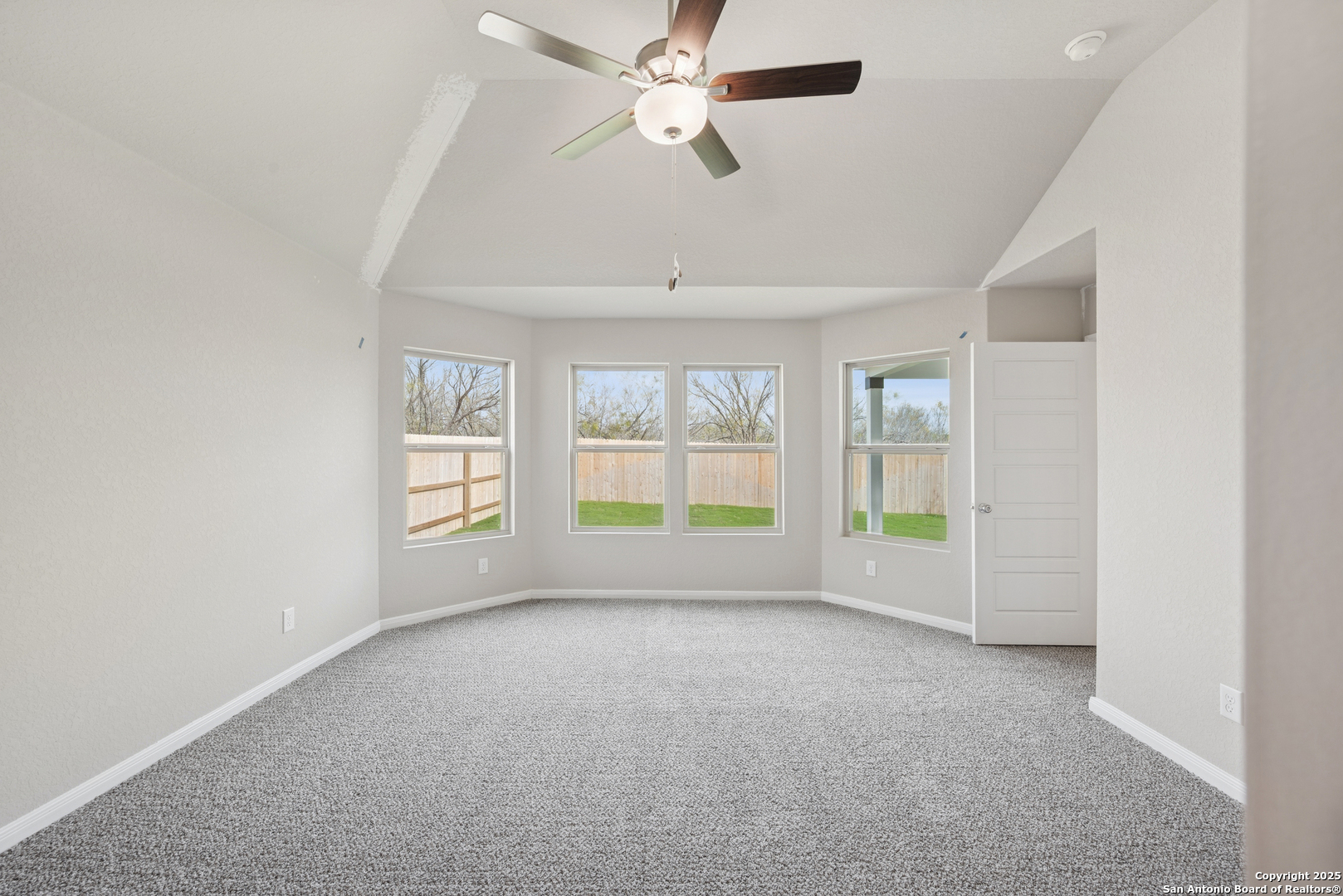 2825 Sun Bayou Seguin, TX 78155 - Photo 19 of 40 an empty room with windows and ceiling fan