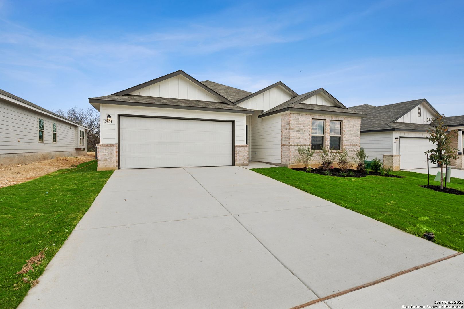 2825 Sun Bayou Seguin, TX 78155 - Photo 39 of 40 a front view of a house with a yard and garage