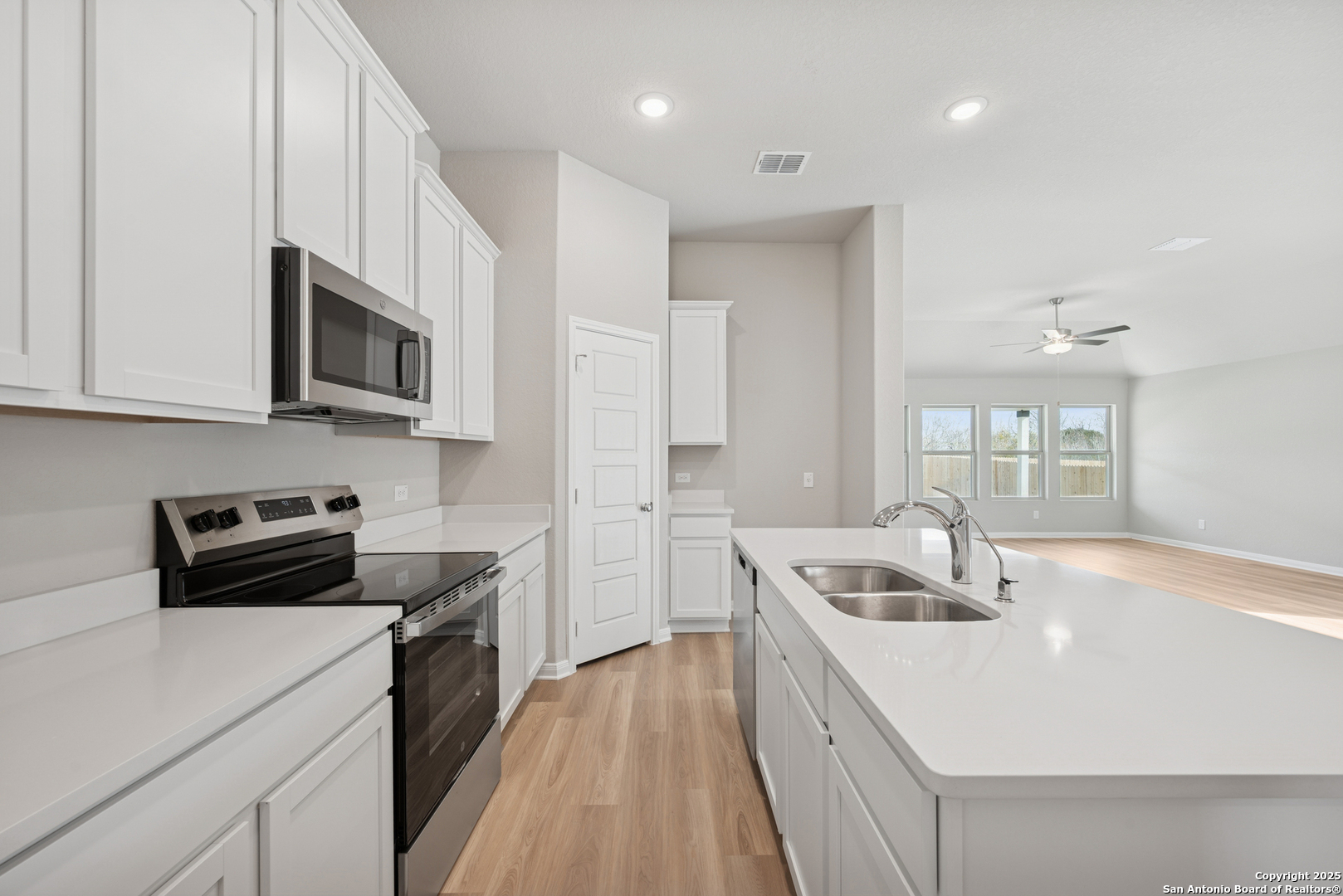 2825 Sun Bayou Seguin, TX 78155 - Photo 4 of 40 a kitchen that has a sink and a stove top oven