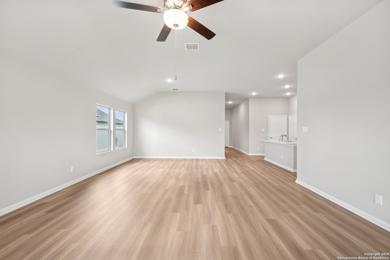 2825 Sun Bayou Seguin, TX 78155 - Photo 6 of 40 a view of an empty room with wooden floor and a window
