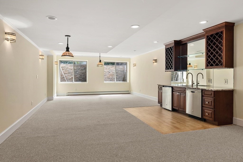 53 Van Roosen Road Newton, MA 02459 - Photo 25 of 34 a view of a kitchen with stainless steel appliances granite countertop a stove and a sink