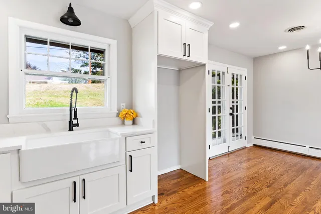 a view of kitchen with wooden floor