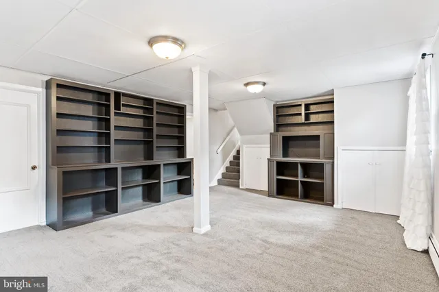 a view of an empty room with a closet