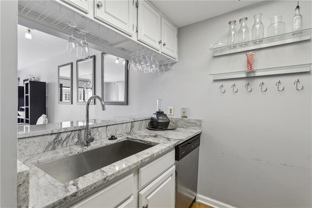 3481 Lakeside Drive Northeast, Unit 3004 Atlanta, GA 30326 - Photo 8 of 14 a bathroom with a sink and a mirror