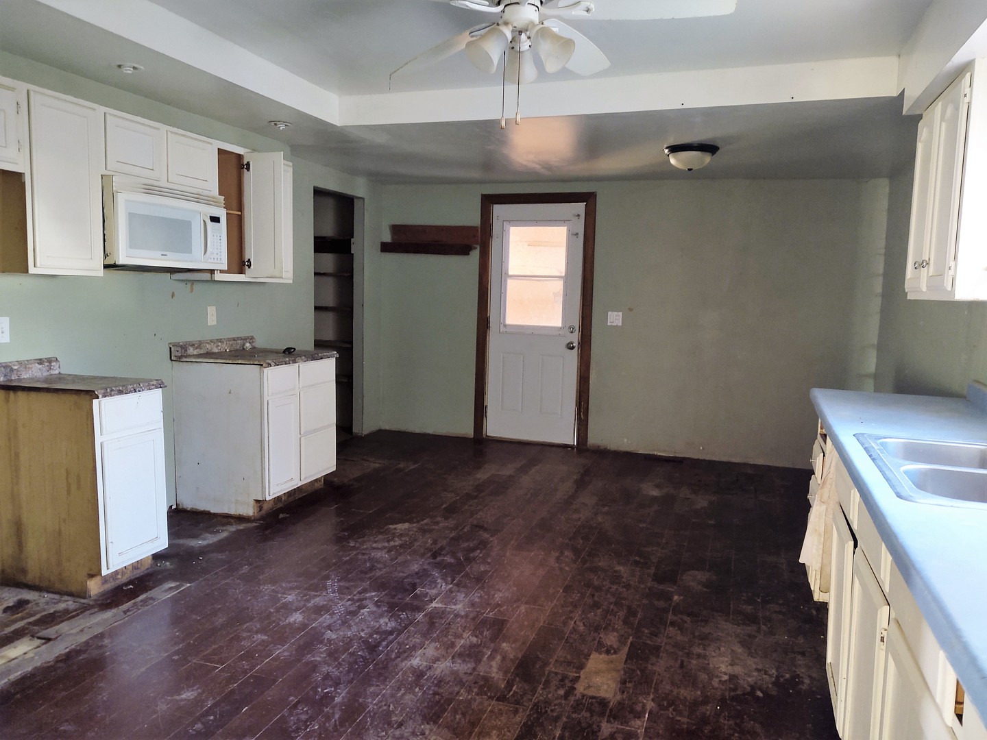 515 Thunderhawk Road Ozark, IL 62972 - Photo 6 of 10 a view of a kitchen with a sink cabinets and wooden floor
