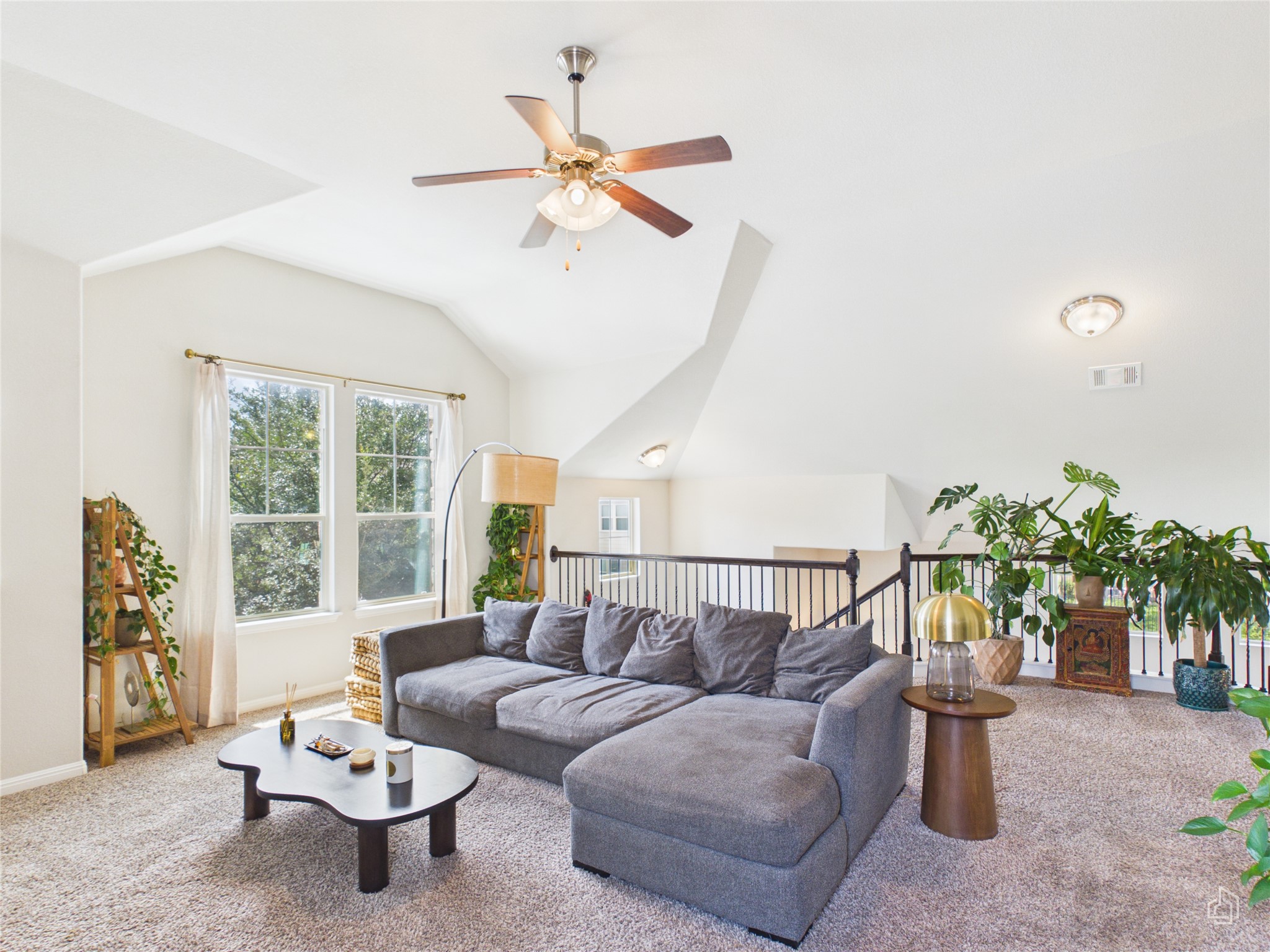 9310 Tanager Way Austin, TX 78748 - Photo 17 of 32 A spacious living area with soaring vaulted ceilings offers ample natural illumination.