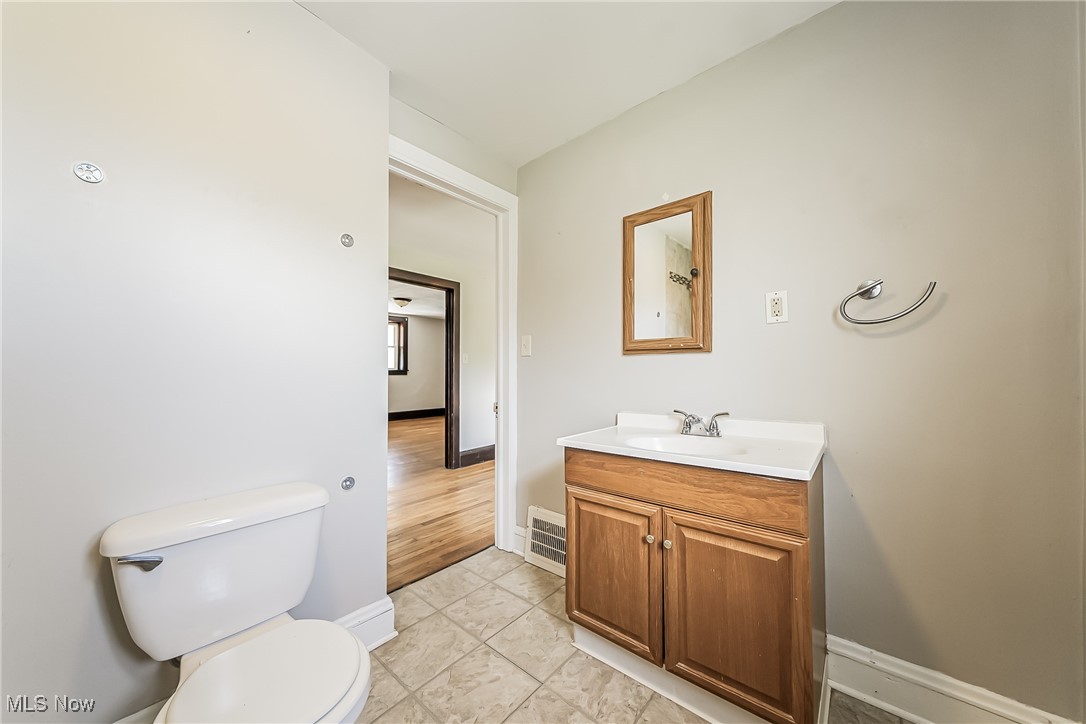 1801 Rockefeller Road Wickliffe, OH 44092 - Photo 20 of 37 Bathroom featuring hardwood / wood-style flooring, vanity, and toilet