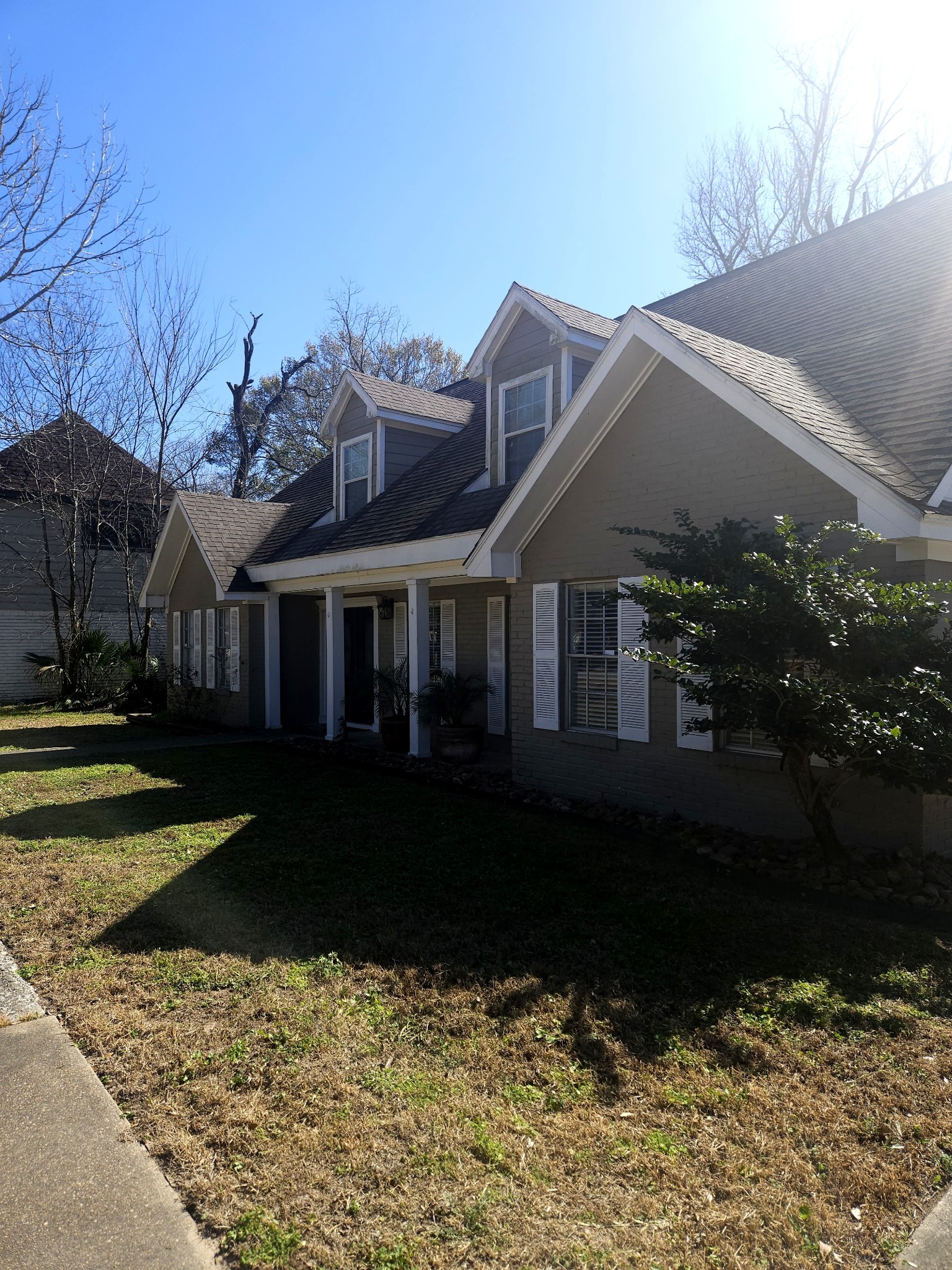 544 Brandon Road Conroe, TX 77302 - Photo 1 of 16 a front view of a house with a garden